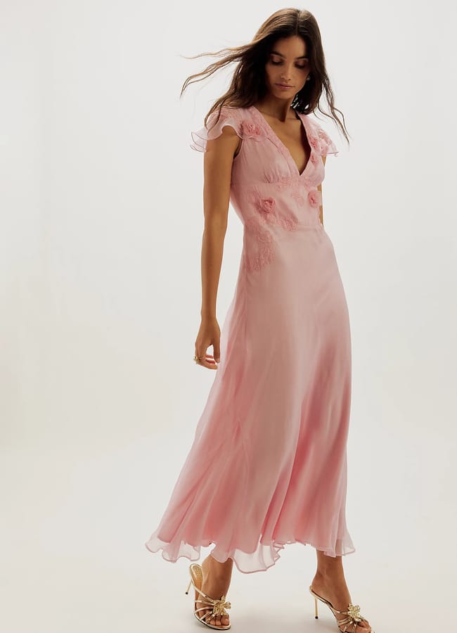 model wearing pink Free People Nigel Preston Sunset Maxi Dress