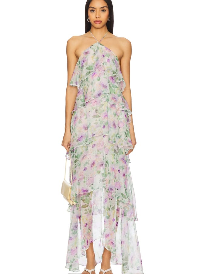 model wearing sheer tired floral dress with halterneck
