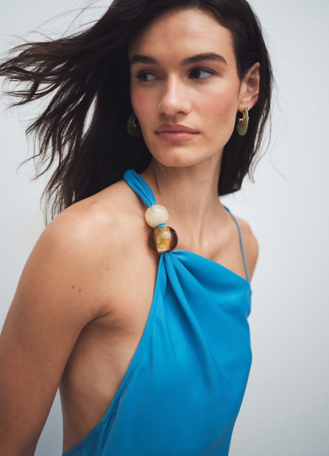 model headshot wearing topshop blue and beaded one shoulder dress
