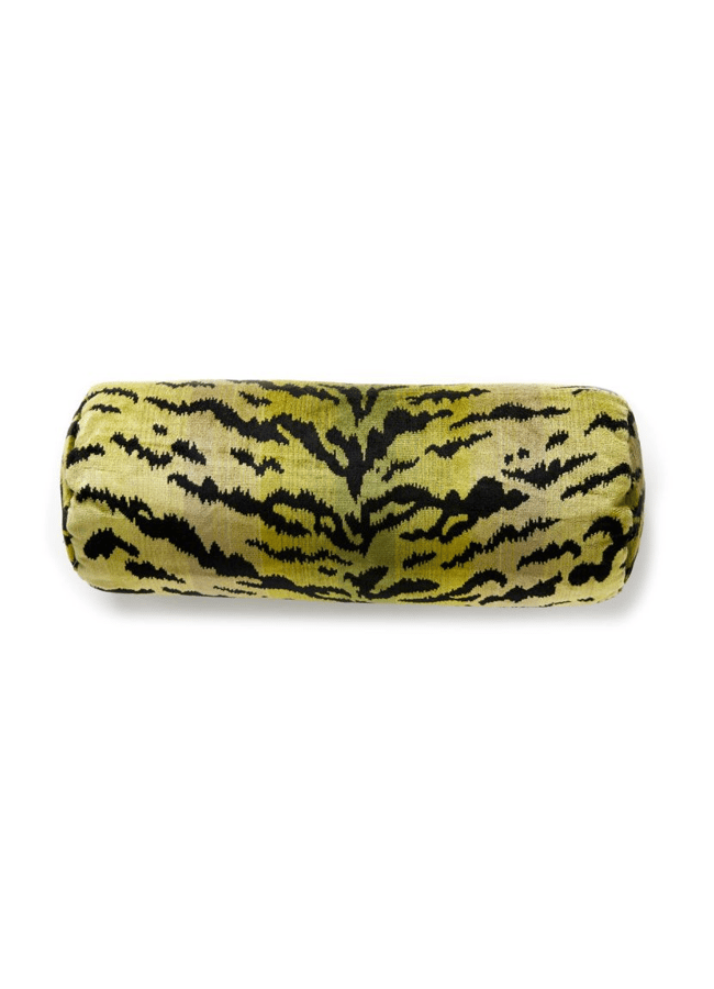 A cylindrical bolster cushion with a green, yellow, and black tiger stripe pattern, shown against a plain white background—perfect for the bold Interiors Insider.