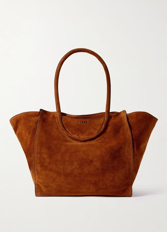 A brown suede tote bag with double handles and a wide opening, perfect for fans of large bags, displayed against a plain white background.