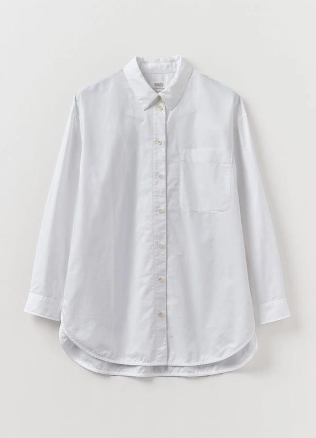 A sheer white button-up long-sleeve shirt with a collar and a single chest pocket, displayed against a light background.