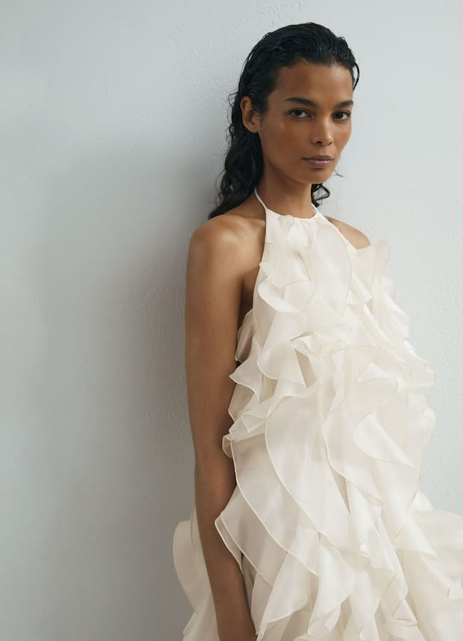 model wearing Reiss Atelier Off White Silk-Organza Ruffle Mini Dress in Off White