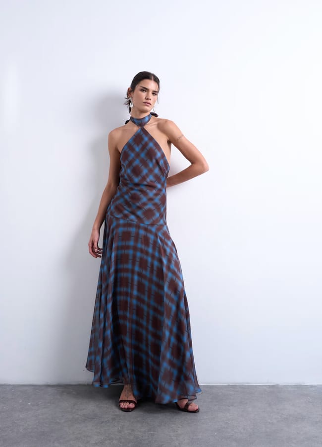 model wearing Volume hem dropped waist maxi dress in blue check chiffon by topshop