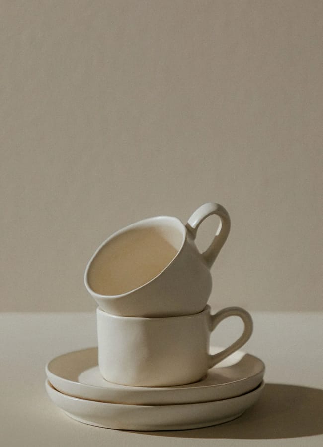 stacked cream coffee cups