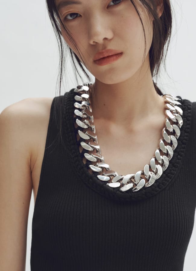 model wearing black and silver Chain-detail ribbed vest top