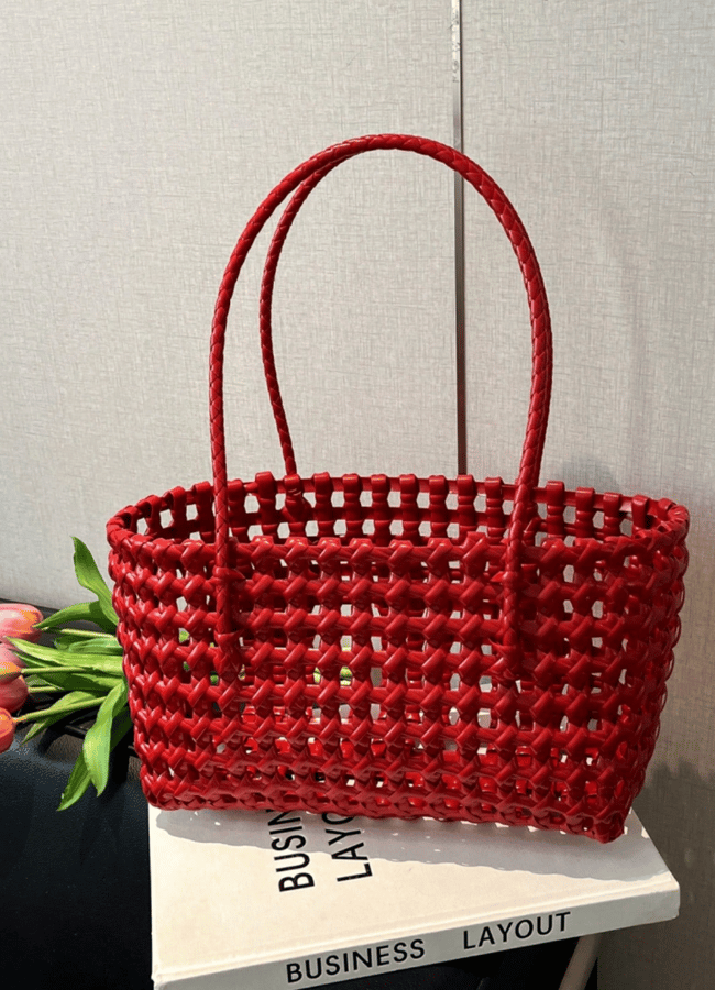 red straw woven beach bag