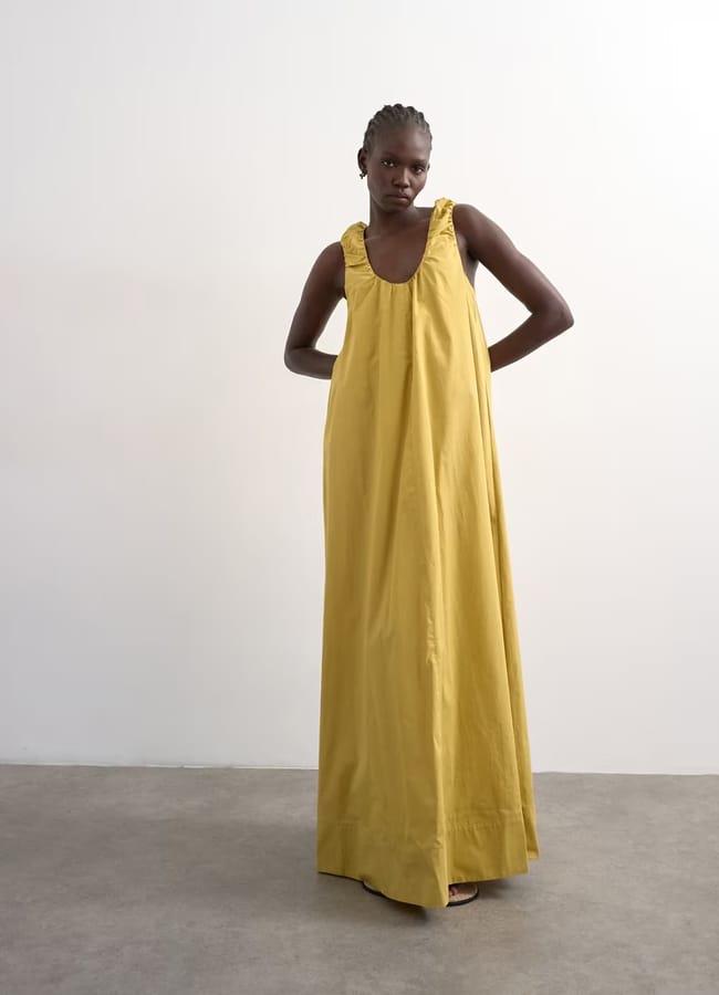 model wearing green ruched dress