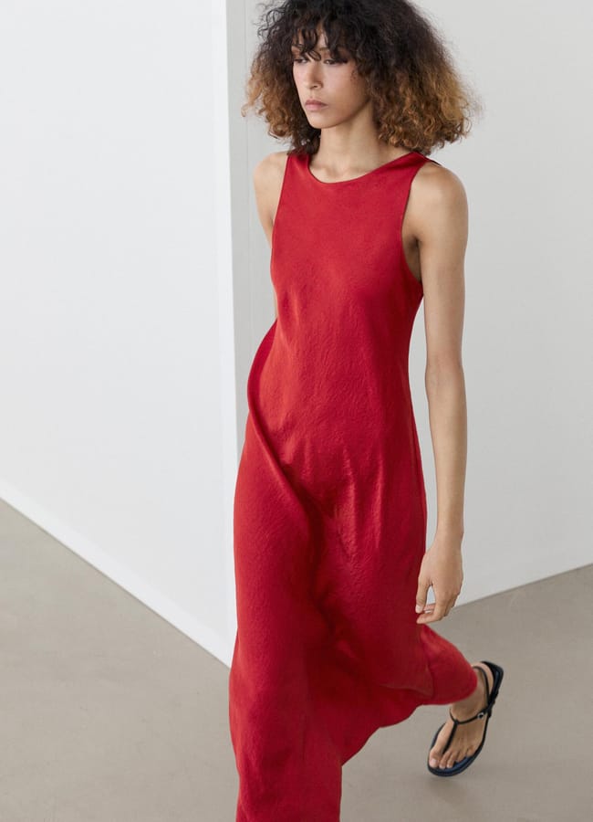 model walking in red MD Flowing satin midi dress