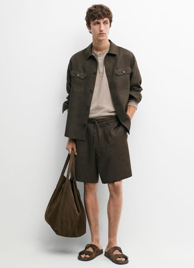 male model wearing brown linen shorts and shirt co-ord