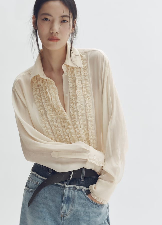 model wearing Silk-blend ruffled-bib blouse