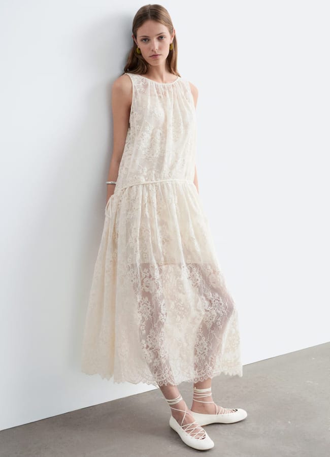 model wearing Other Stories Lace Maxi Dress in white