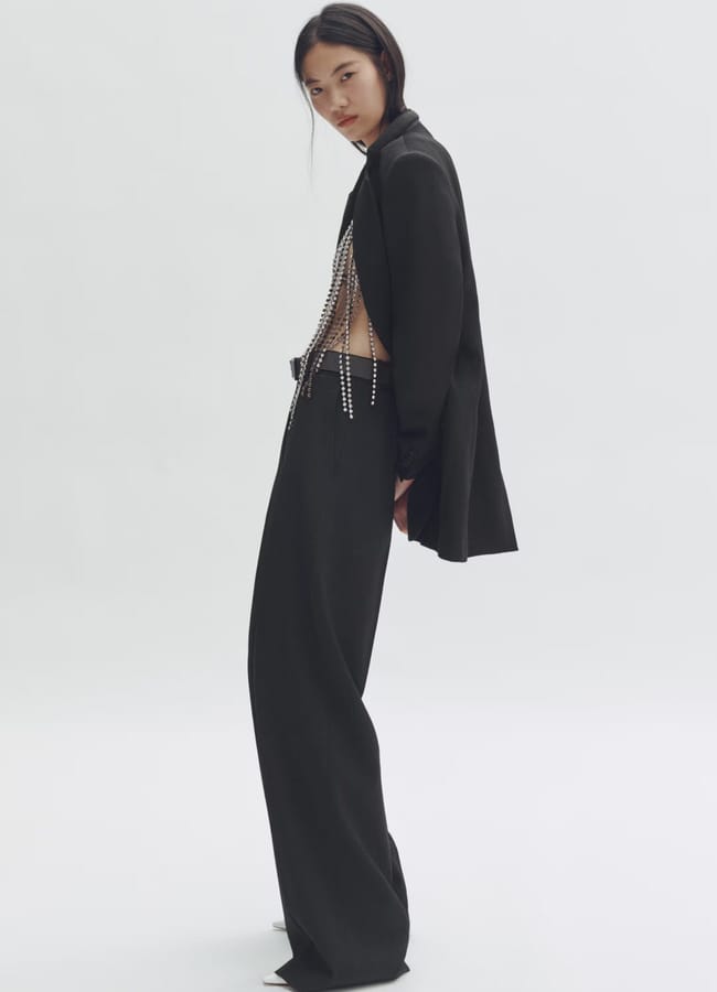model wearing black suit