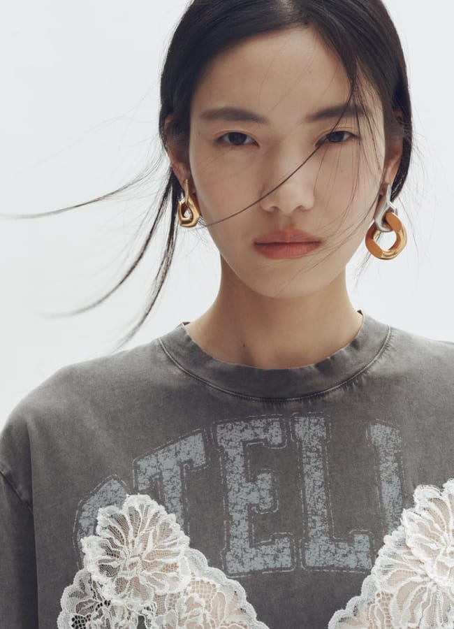 model wearin stella t shirt dress and gold and silver Two-tone earrings