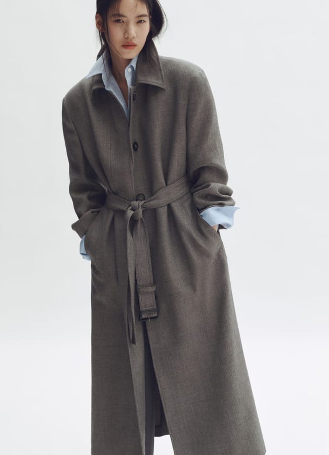 model wearing grey wool car coat by H&M X Stella MCCartney