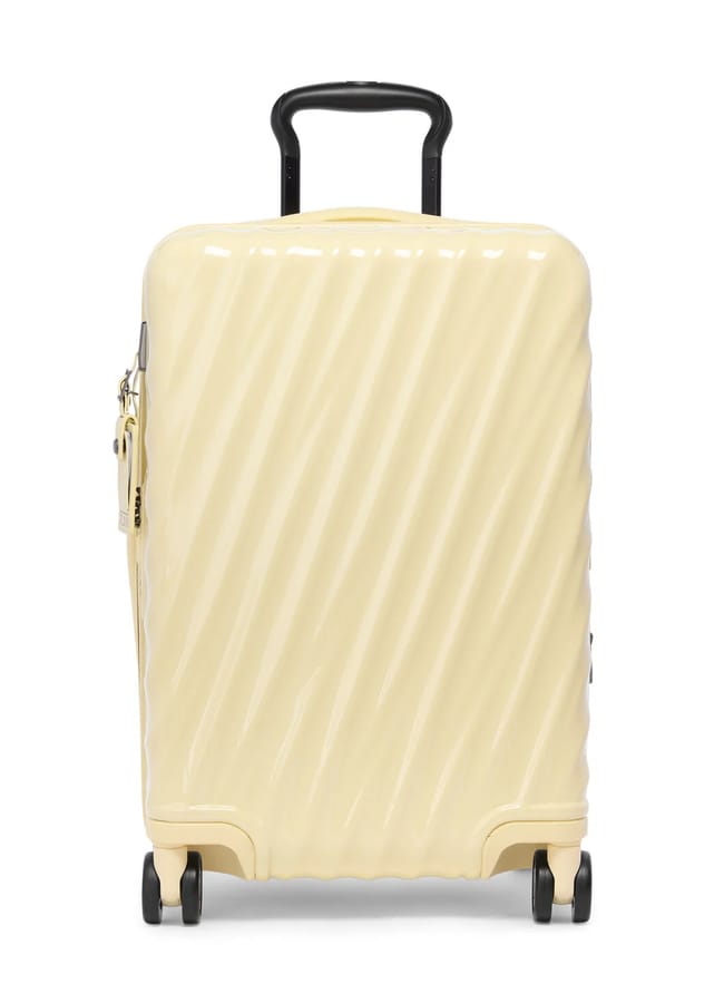 yellow suitcase by tumi