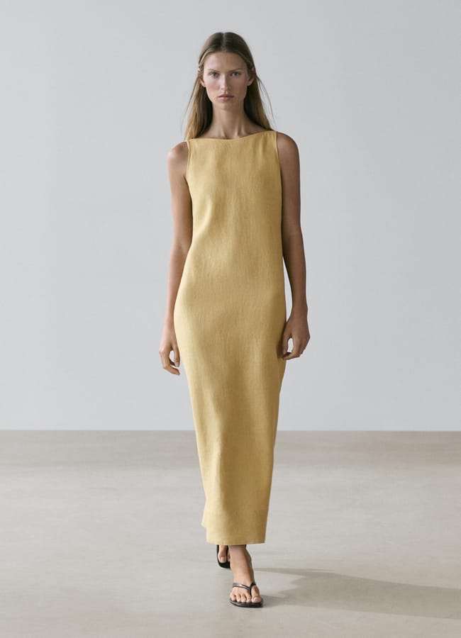 model wearing yellow Linen halter midi dress