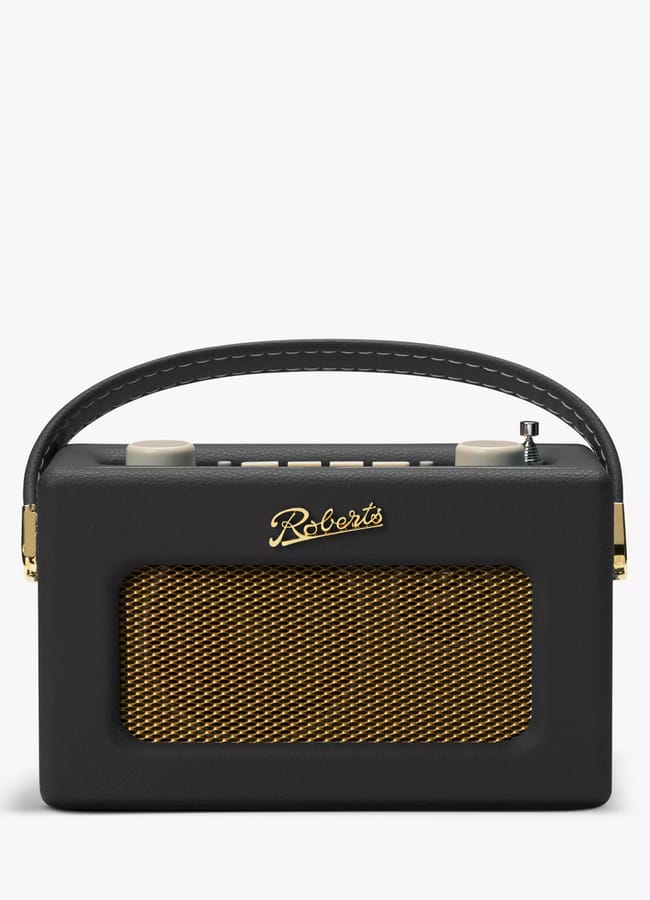 A black retro-style portable radio with a gold mesh speaker grille, a stitched handle, control knobs on top, and the brand name Roberts in gold above the speaker—perfect for unique Fathers’ Day gifts 2026.