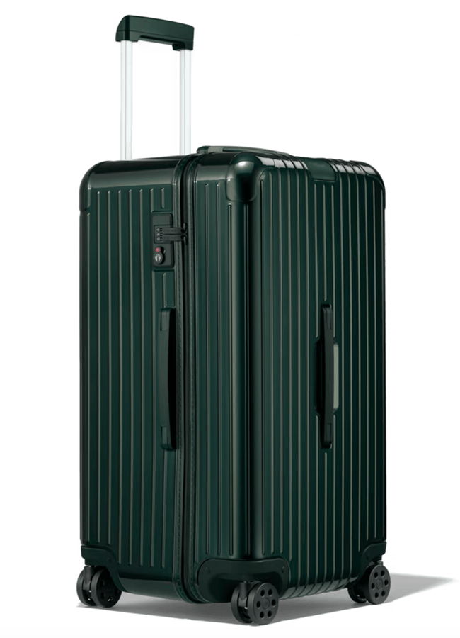 A dark green hard-shell suitcase from one of the best suitcase brands, featuring a vertical ridged pattern, four wheels, an extended retractable handle, and side handles for carrying, photographed against a white background.