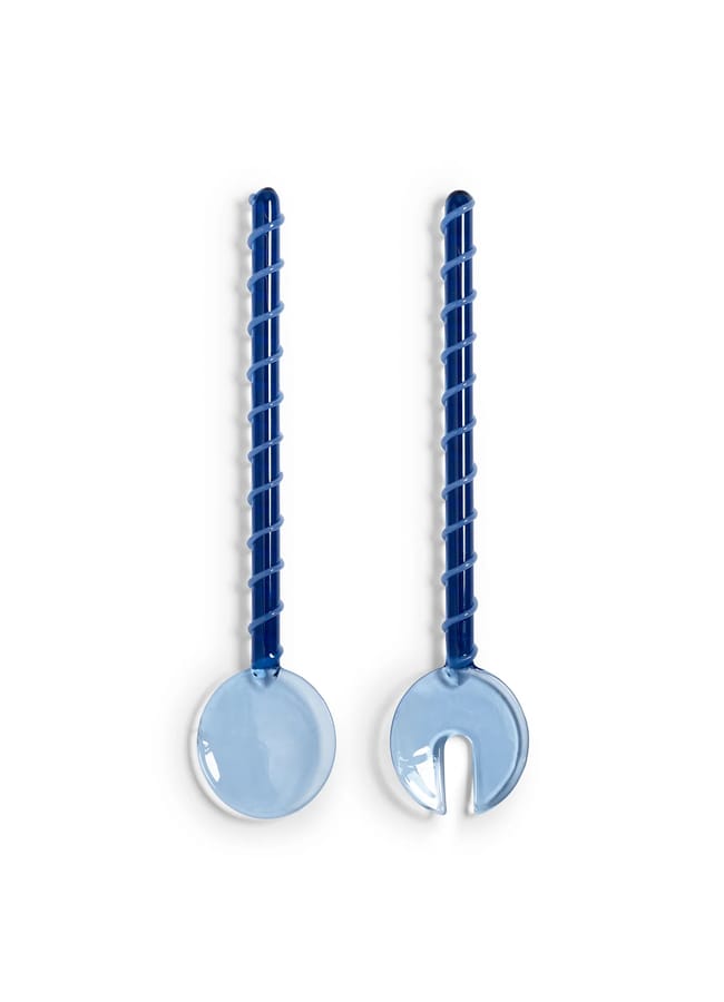 Perfect for salad season, this pair of blue salad servers features spiral, ridged handles—one is a solid spoon, the other has a forked slot for easy serving.