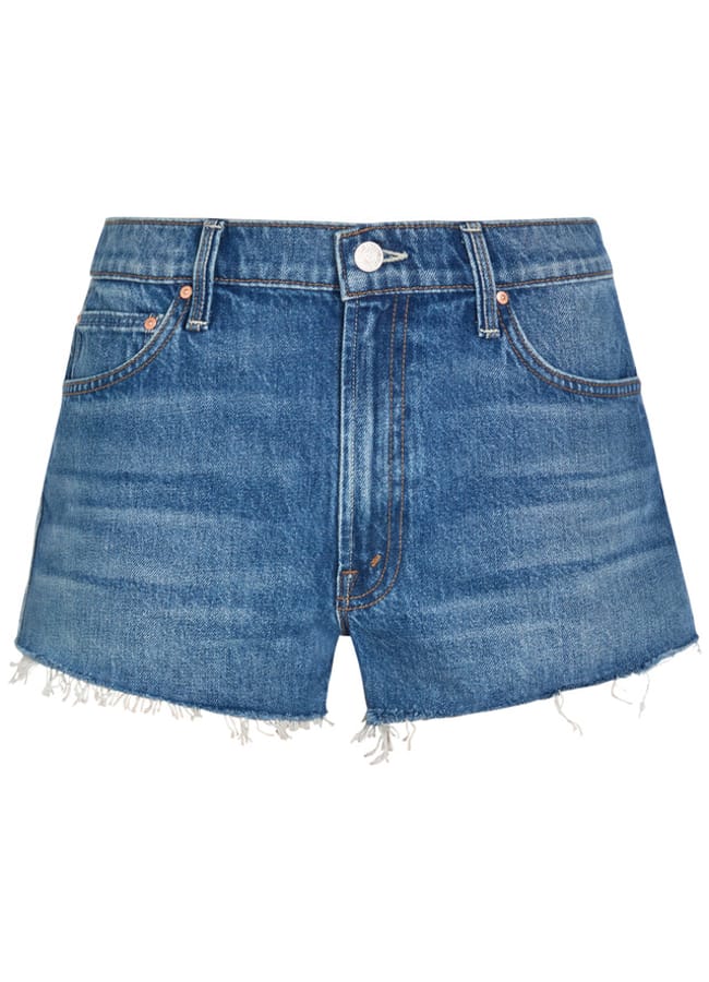 A pair of blue denim shorts with a button and zip fastening, front and back pockets, and frayed hems—your choice for the best denim shorts this season.
