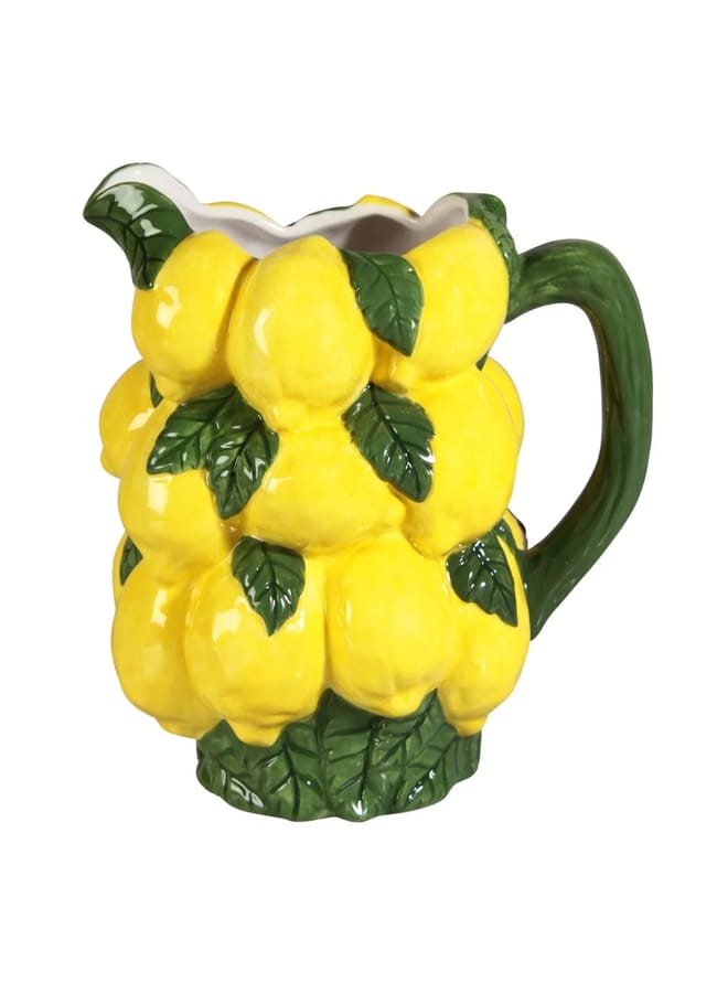A ceramic jug shaped and painted like a cluster of bright yellow lemons with green leaves and a green handle, this piece makes a charming addition to any collection of foodie homewares.