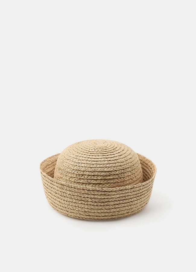 A natural woven straw hat with a flat brim and a rounded crown, displayed on a plain white background—perfect for pairing with your favourite oversized shirt outfit ideas.