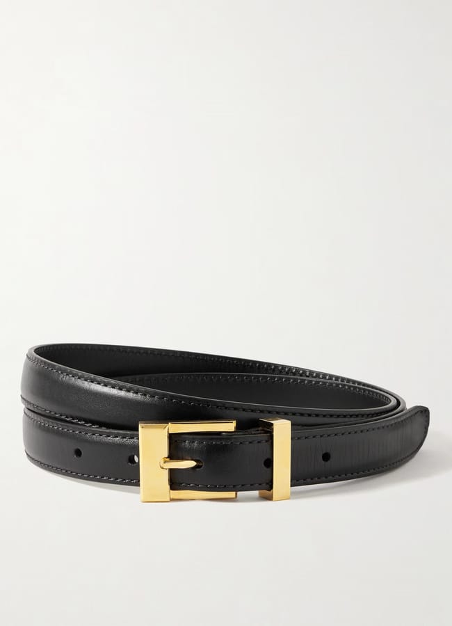 A black leather belt with a shiny gold rectangular buckle, neatly coiled against a plain white background—perfect for elevating your look during our summer sale.