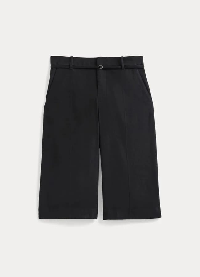 Black knee-length tailored shorts with belt loops, a front button and zip fastening, and side pockets, displayed against a plain white background—perfect for pairing with oversized shirt outfit ideas.