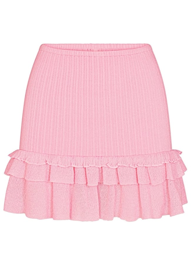 A pink, ribbed mini skirt featuring two layers of frills at the hem, reminiscent of carefree celebrity couples on holiday, displayed on a white background.