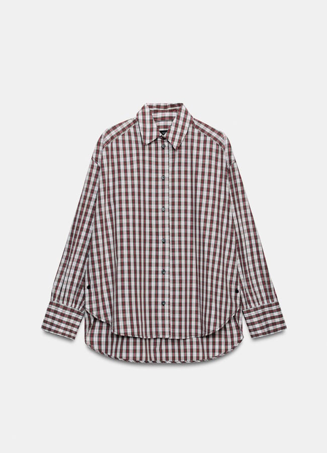A loose-fitting, long-sleeve button-up shirt with a maroon, white, and navy blue checked pattern—new in at Zara—displayed against a plain white background.