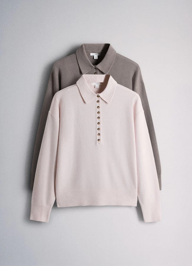 Two long-sleeve collared jumpers, one light pink with front buttons layered over a taupe jumper, both displayed against a neutral background—quintessential pieces inspired by minimalist high street brands.
