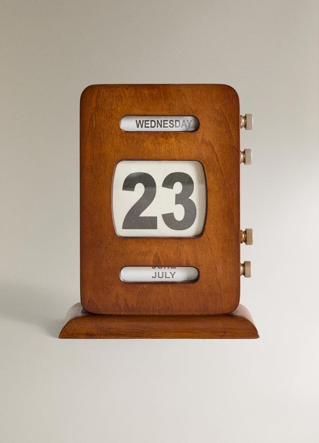 A vintage wooden desk calendar displaying Wednesday, 23 July, with rotating wheels to change the date, day, and month—an ideal piece of chic homeware under £50.