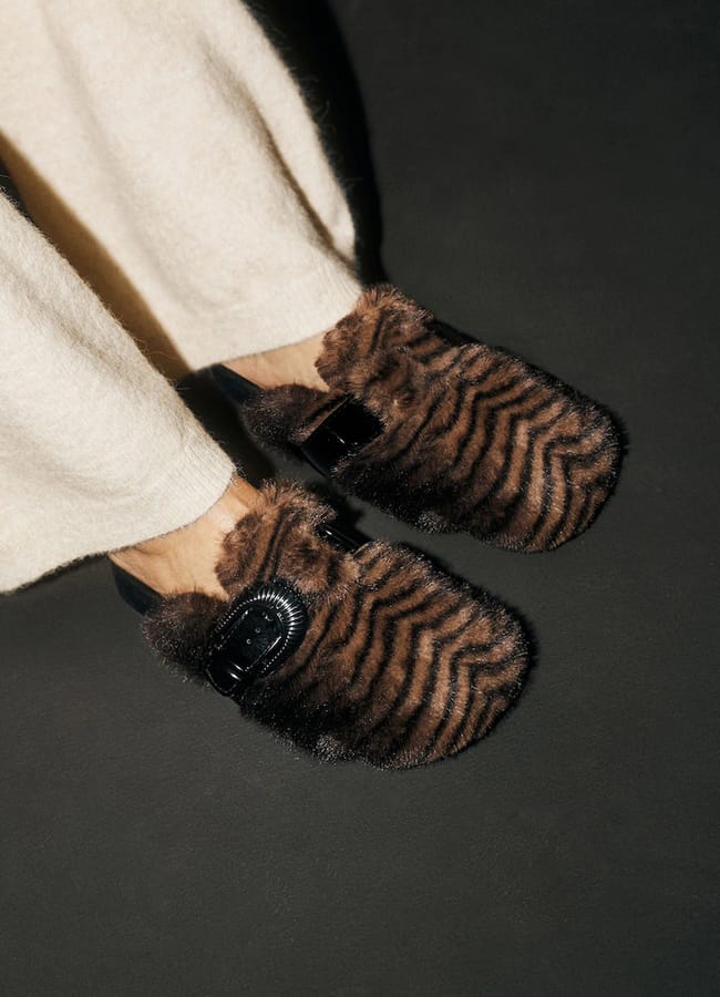 Rockett St George brown faux-fur mules with a black buckle strap.