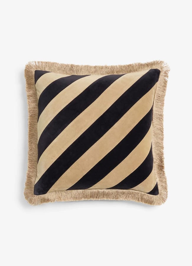 Square Rockett St George cushion featuring black and tan diagonal stripes with a tan fringe border.
