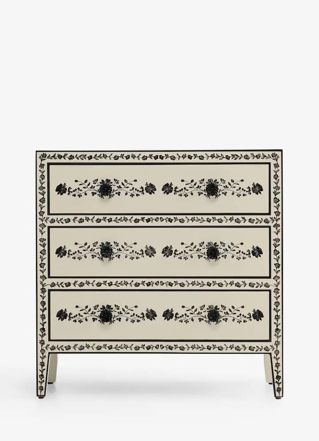 Rockett St George cream three-drawer chest featuring black floral inlay patterns and decorative black drawer handles.