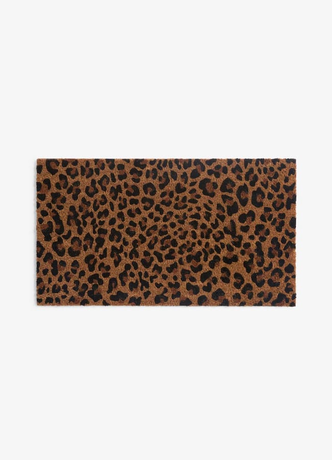 Rectangular Rockett St George doormat with a brown and black leopard print pattern.