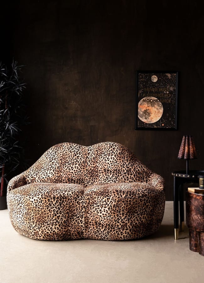 Lip-shaped Rockett St George sofa upholstered in leopard print fabric.