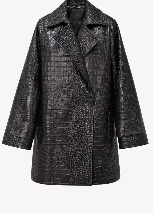 Black single-breasted coat from a black owned fashion brand, featuring a notched collar and an embossed crocodile-texture finish.