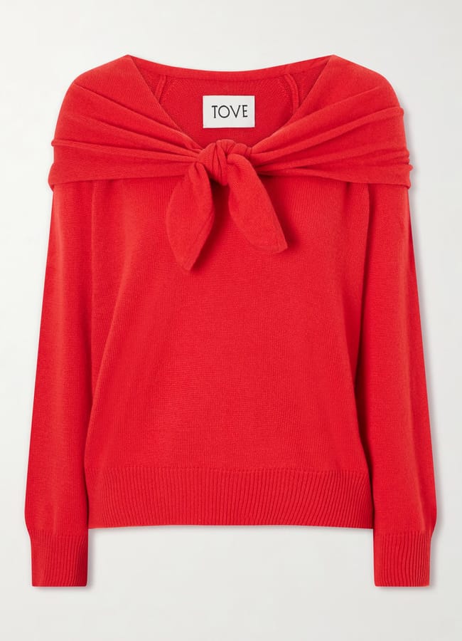 Red long-sleeve knitted jumper by Tove, a Black-owned fashion brand, featuring a tie detail at the neckline.