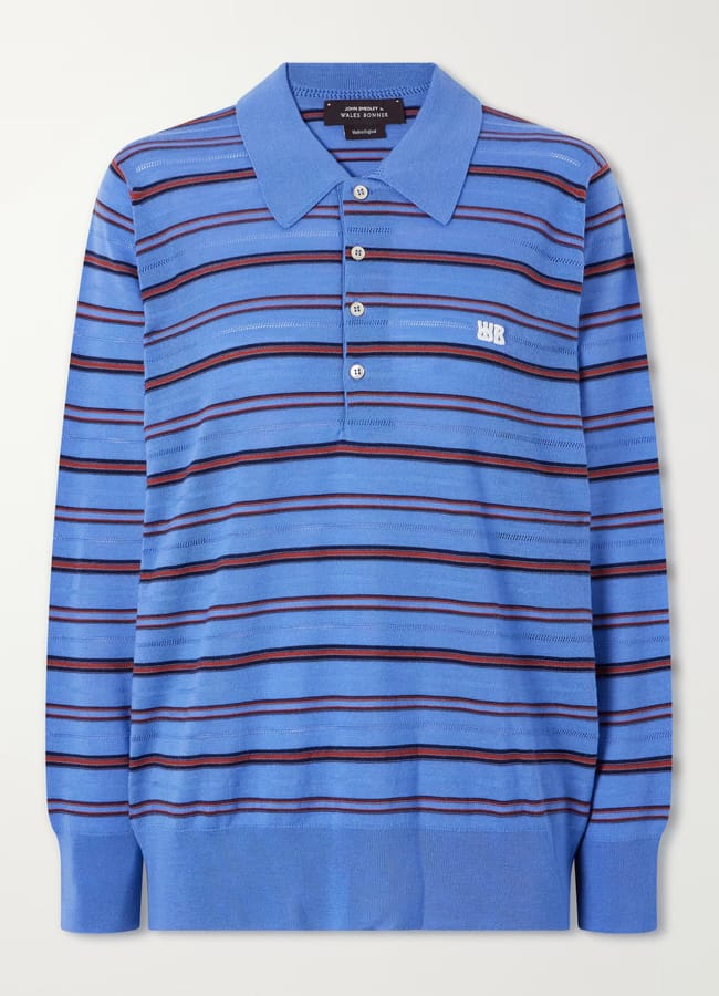 Blue long-sleeved polo shirt with horizontal red and black stripes and a white embroidered logo, a standout piece from emerging British fashion brands.