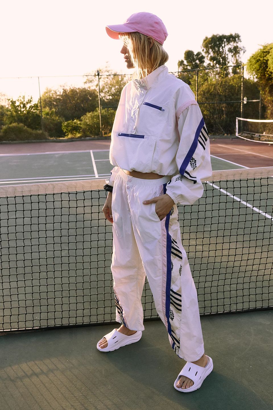 model in sports wear on tennis court