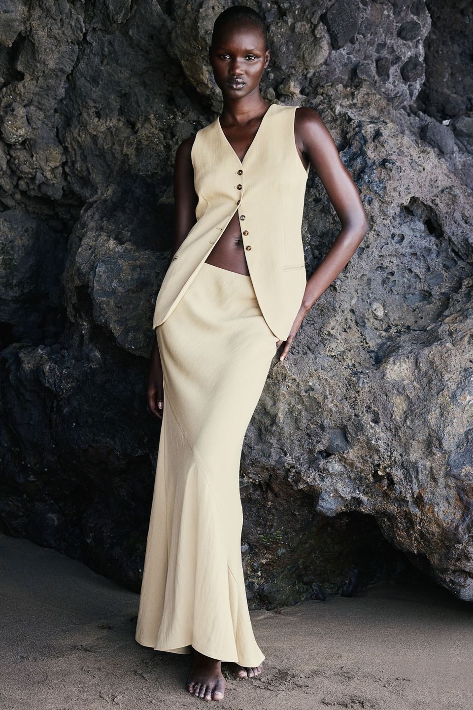 model in waistcoat and flared long skirt