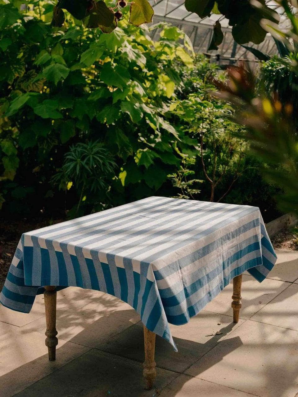 blue striped tablecloth on garden table