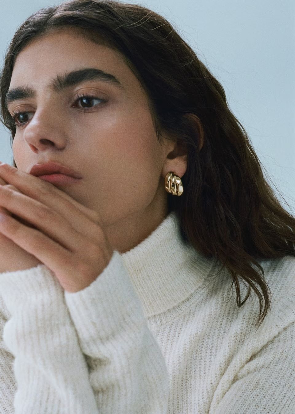 model wears Three hoop earrings