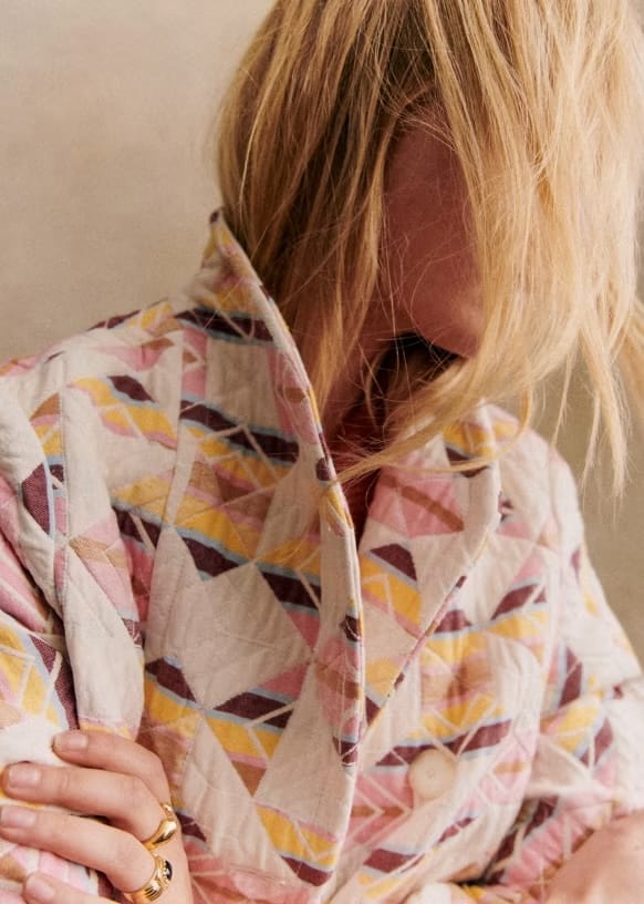 model close up wearing KALVIN COAT in Multicoloured jacquard