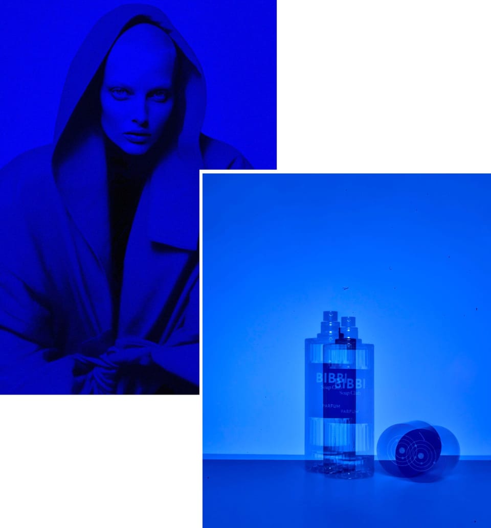 campaign shot of model and fragrance bottle