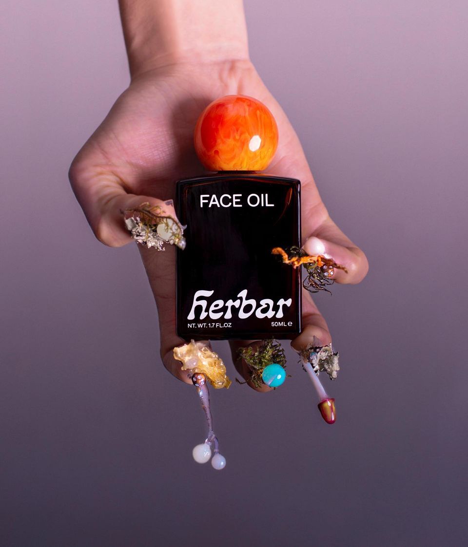 hand holding herbar bottle
