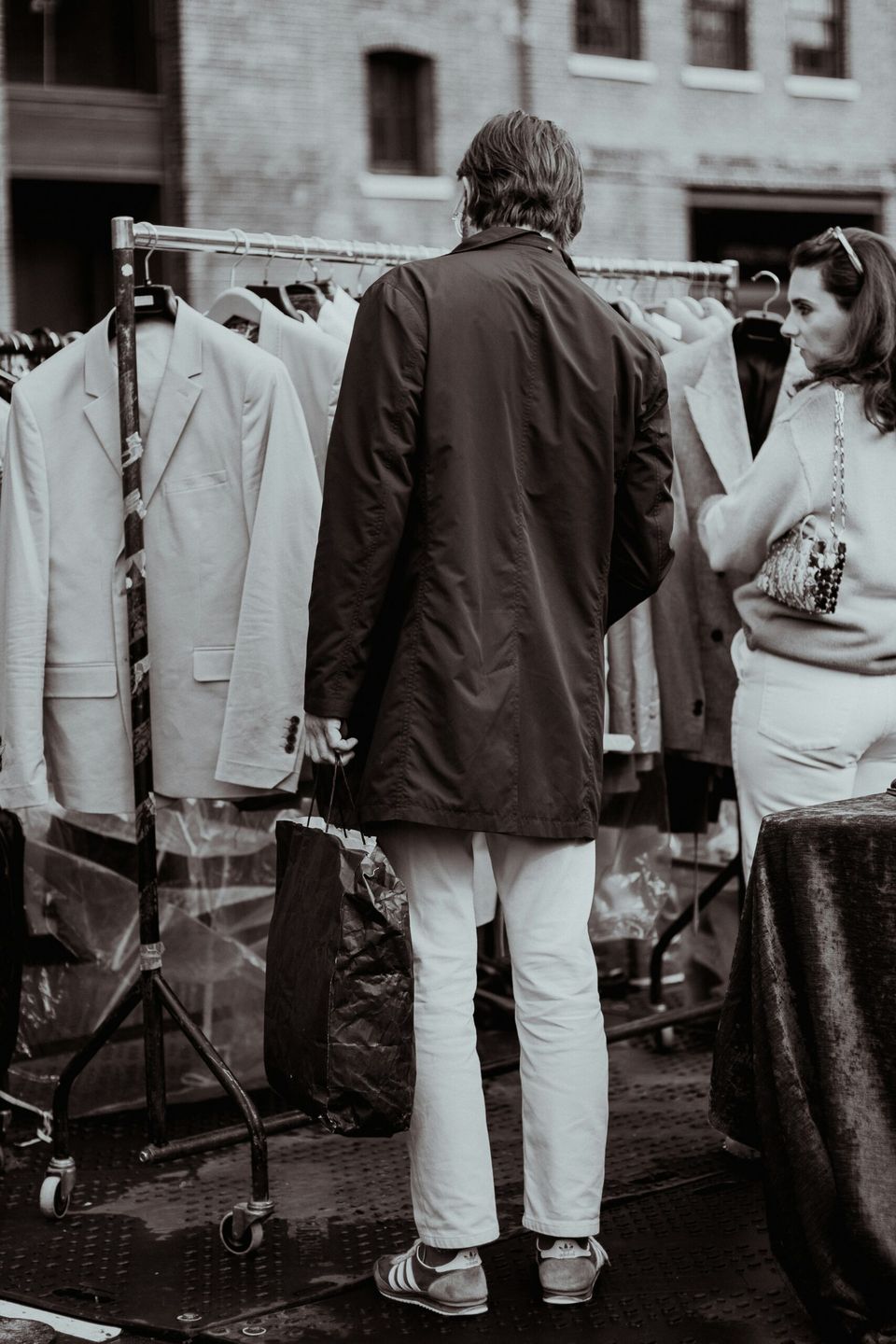 black and white image of man at vintage market