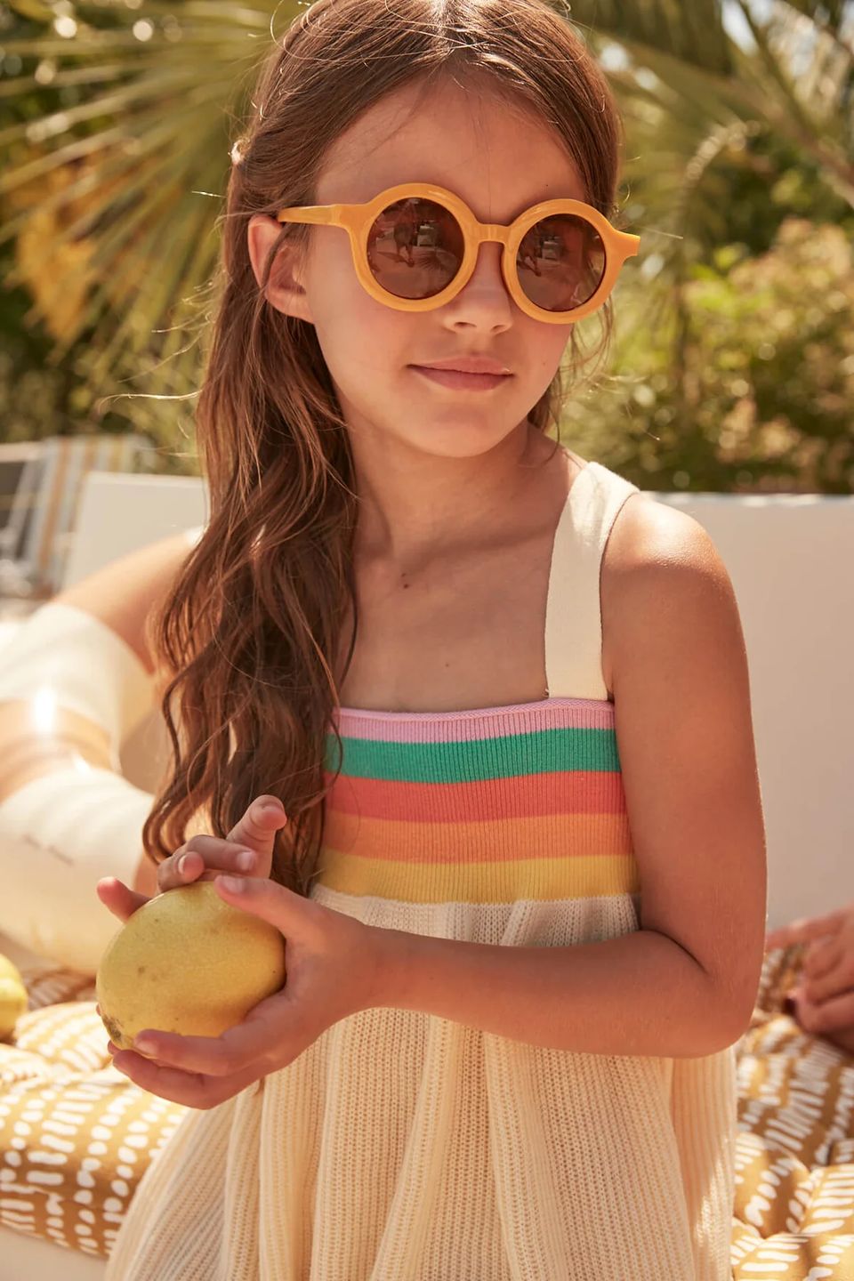 young girl model wearing sundress and sunglasses